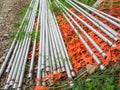 Group of long shiny metal pipes on the floor Royalty Free Stock Photo