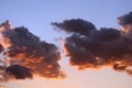 Lush, pink and violet clouds against a blue and violet sky