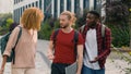 Group of mad emotional students multiracial friends Caucasian man guy with African American woman girl and ethnic guy Royalty Free Stock Photo