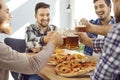 Group of male close friends eating pizza and drinking beer Royalty Free Stock Photo