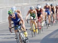 Group of male cycling triathlon competitors fighting