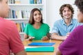 Group of male and female students preparing for exam