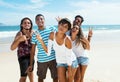 Group of male and female young adults dancing at beach Royalty Free Stock Photo