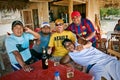 Group of male friends drinking beer in a bungalow Royalty Free Stock Photo