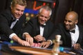 Group of male friends at roulette table