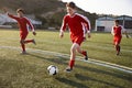 Group Of Male High School Students Playing In Soccer Team