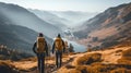 Group of male hikers admiring a scenic view from a mountain top. Adventurous young men with backpacks. Hiking and trekking on a