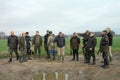 Group of male hunters discussing where to go next. Winter Netherlands. Hunting group