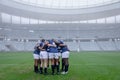 Group of male rugby players forming huddles in the morning Royalty Free Stock Photo