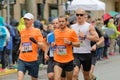 Group of male runner in orange shirts