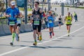 group male runners run down street during Kazan Marathon