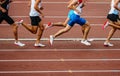 group male runners running middle distance race side view