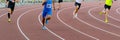 group male runners running track of stadium sprint race