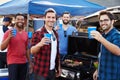 Group Of Male Sports Fans Tailgating In Stadium Car Park Royalty Free Stock Photo