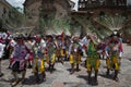 A group of man wearing traditional clothes and masks during the Huaylia on Christmas day in front of the Cuzco Cathedral