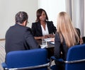 Group of managers interviewing female candidate