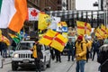 A group marching with County Antrim flags at the Saint Patrick\'s Day parade on Queen Street