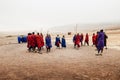 Group Masai or Maasai tribe peoples in red and blue cloth dancing. Ethnic group of Ngorongoro Consevation, Serengeti in Tanzania