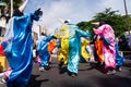 Group of masked people are dancing in the street during the pre-carnival Fuzue parade