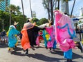 Group of masked people are dancing in the street during the pre-carnival Fuzue parade