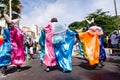 Group of masked people are dancing in the street during the pre-carnival Fuzue parade