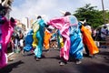 Group of masked people are dancing in the street during the pre-carnival Fuzue parade