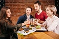 Group of mates enjoying night out at Burger Bar Royalty Free Stock Photo