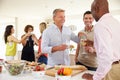 Group Of Mature Friends Enjoying Dinner Party At Home Royalty Free Stock Photo