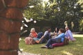 Group Of Mature Friends Enjoying Drinks In Backyard Together Royalty Free Stock Photo