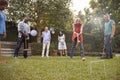 Group Of Mature Friends Playing Croquet In Backyard Together Royalty Free Stock Photo