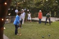 Group Of Mature Friends Playing Croquet In Backyard Together Royalty Free Stock Photo