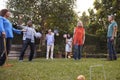 Group Of Mature Friends Playing Croquet In Backyard Together Royalty Free Stock Photo