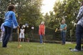 Group Of Mature Friends Playing Croquet In Backyard Together Royalty Free Stock Photo