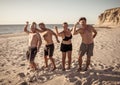 Group of mature happy active adults having fun in the beach. Long time friends Royalty Free Stock Photo