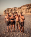 Group of mature happy active adults having fun in the beach. Long time friends Royalty Free Stock Photo