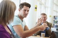 Group Of Mature Students Collaborating On Project In Library Royalty Free Stock Photo