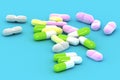 A Group of Medical Pills on a blue background Royalty Free Stock Photo