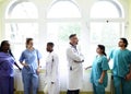 Group of medical professionals discussing in the hallway of a hospital