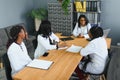 Group Of Medical Staff Meeting Around Table In Hospital. Royalty Free Stock Photo