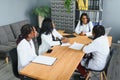 Group Of Medical Staff Meeting Around Table In Hospital. Royalty Free Stock Photo