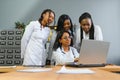 Group Of Medical Staff Meeting Around Table In Hospital. Royalty Free Stock Photo