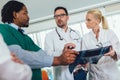 Group of medics discuss x-ray scan Royalty Free Stock Photo