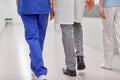 Group of medics or doctors walking along hospital Royalty Free Stock Photo