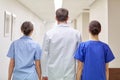 Group of medics or doctors walking along hospital Royalty Free Stock Photo