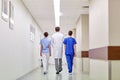 Group of medics or doctors walking along hospital Royalty Free Stock Photo