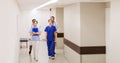 Group of medics or doctors walking along hospital Royalty Free Stock Photo