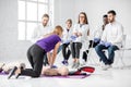 Group of medics during the first aid training indoors Royalty Free Stock Photo