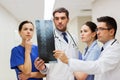 Group of medics with spine x-ray scan at hospital Royalty Free Stock Photo