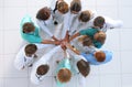 group of medics standing in a circle and joining their palms together Royalty Free Stock Photo