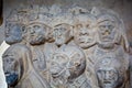 Group of medieval heads carved out of stone in Carcassonne, France